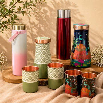 Premium water bottle and glass set with stainless steel bottles and printed cups arranged in a stylish, minimal setup, ideal for daily use, travel, and gifting.